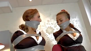 brunette gina and ruby taped up in chair british